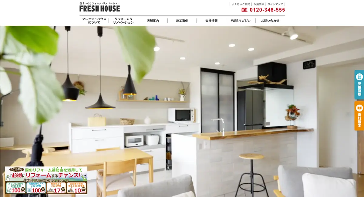 Bright, modern open-plan kitchen and living area with white cabinets, wooden island, and black pendant lights.
